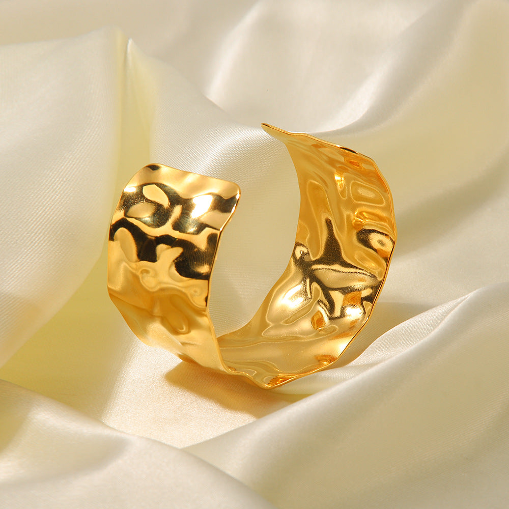 Radiant Intertwined Gold Bangle