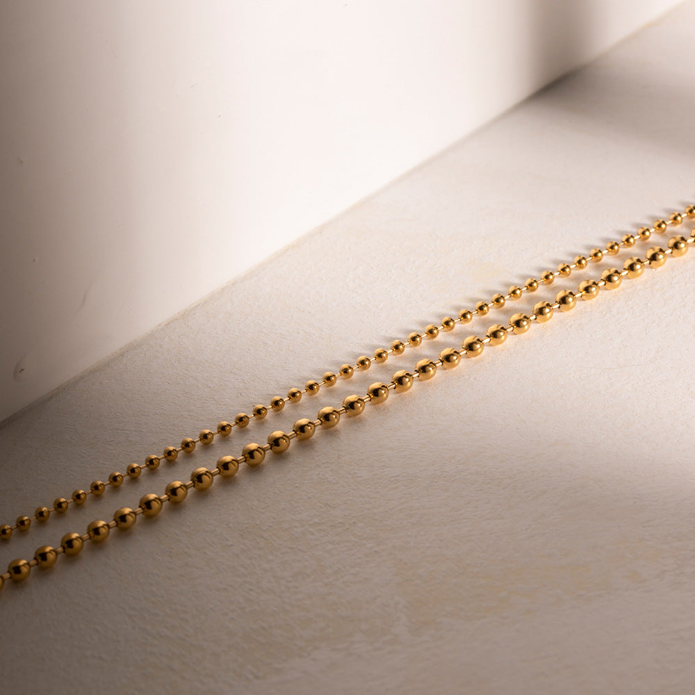 Bold Golden Bead Layered Necklace