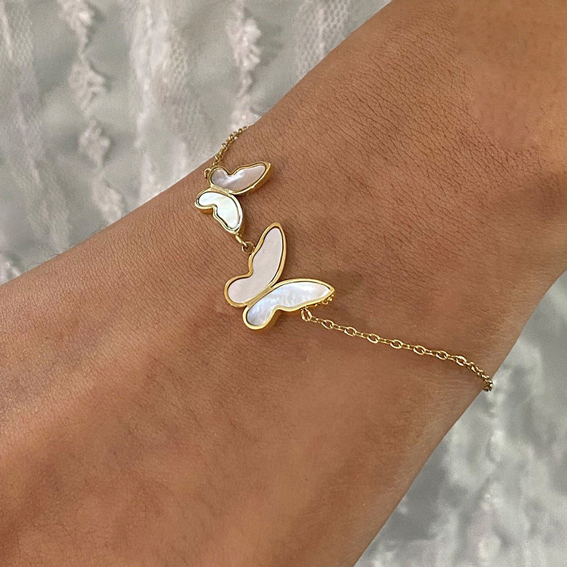 Elegant Butterfly Pearl Charm Bracelet